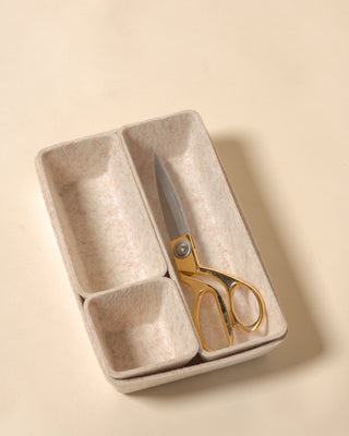 beige drawer organizer set with scissors inside.